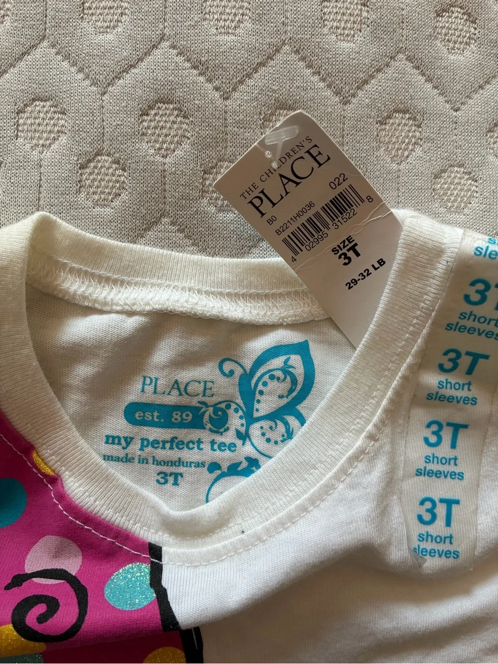 Girl’s White Graphic Tee with Pink Polka-Dot Sneaker Design